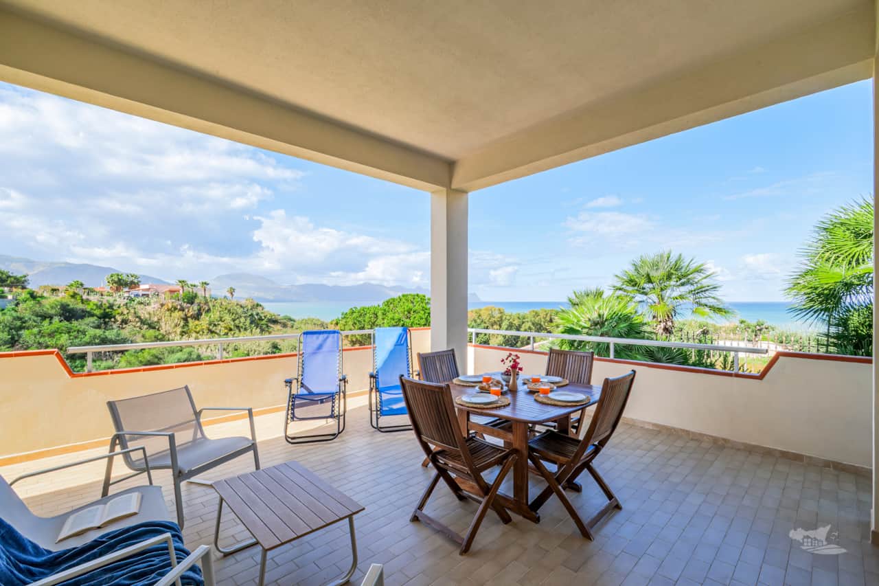 Relax on the stunning veranda with breathtaking sea views and unforgettable sunsets. 
