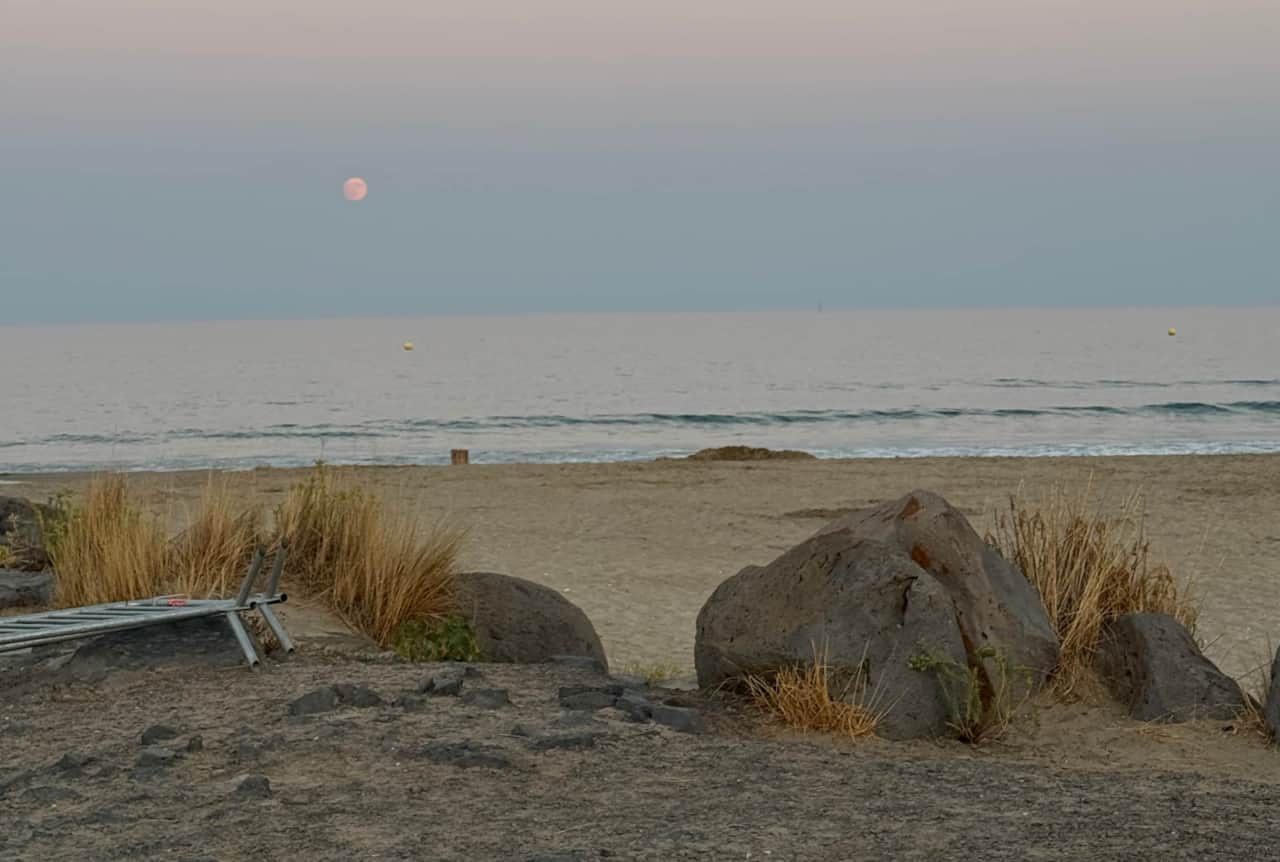 Moon rising over the sea