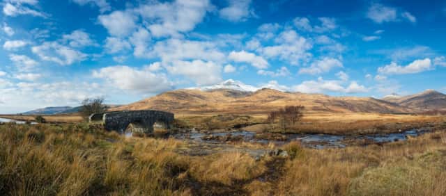 Ben More viewed from Kinloch, with snow on the summit and a stone bridge in the foreground