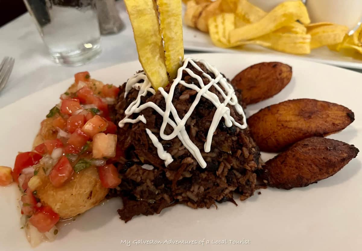 Visitors enjoying Galveston fine dining at Rudy & Pacos in Historic Downtown at night
