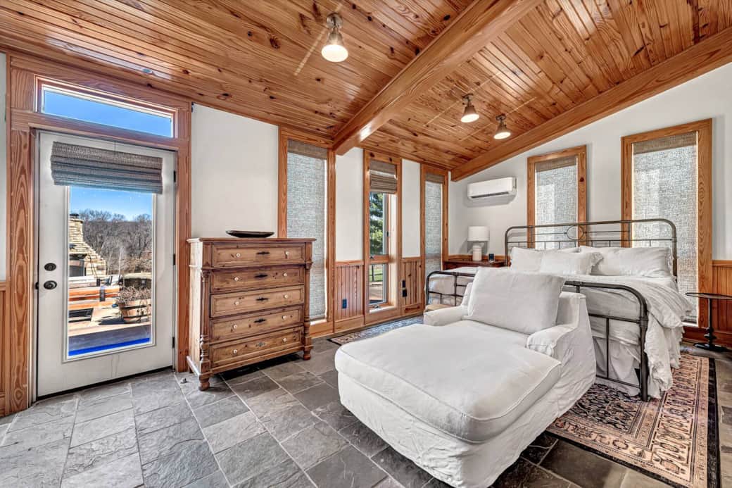 King Size Bedroom private entrance/exit to back porch and fireplace. 