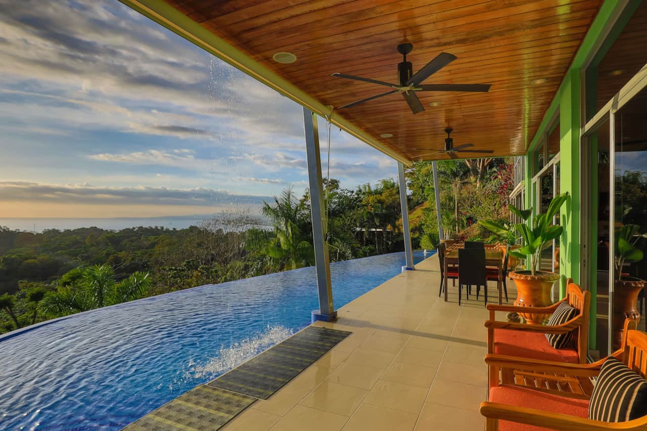 The 62' long saltwater infinity pool with upper level waterfall and lounge area. Relax or swim laps 
