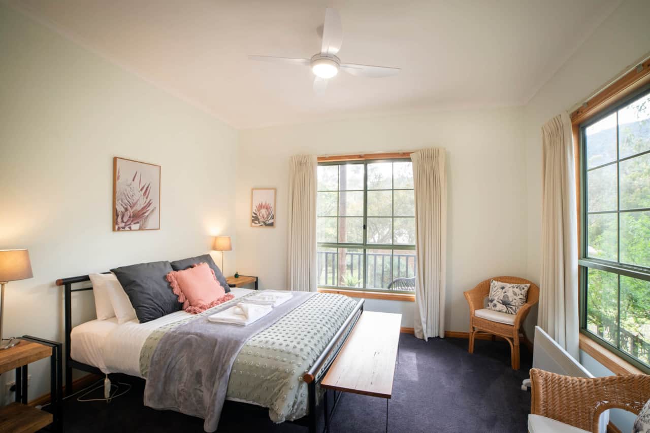 Bedroom One: Warmth, coziness, and inviting ambiance for restful retreats.