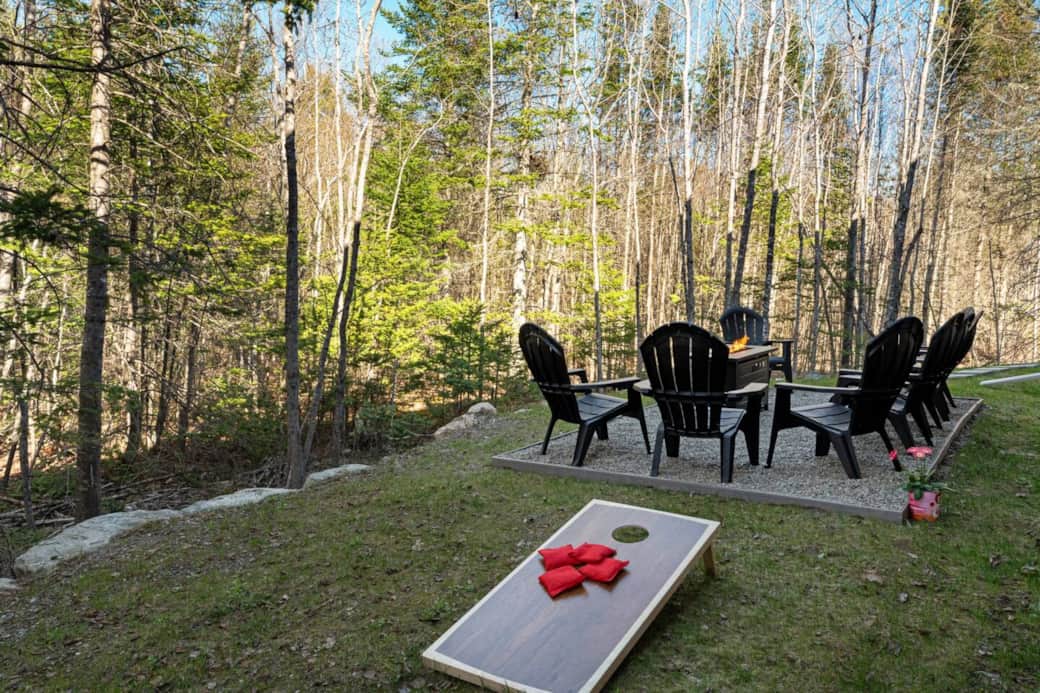 Enjoy the pristine Maine woods with our backyard propane firepit and lawn games