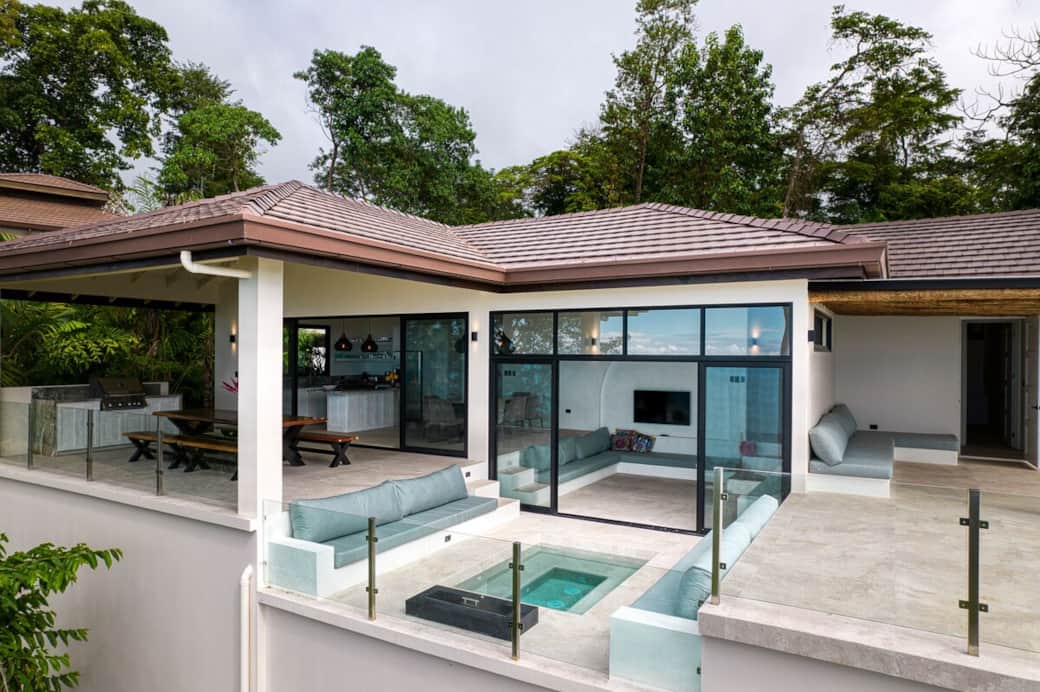 Exterior view of Casa Hecate a mix of elegant and modern design, perched in the green jungle. 