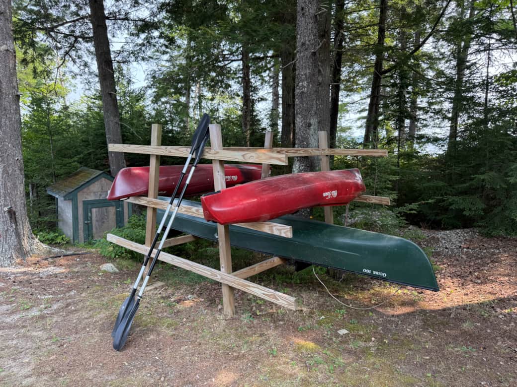 Two single kayaks and a canoe for guests' use.