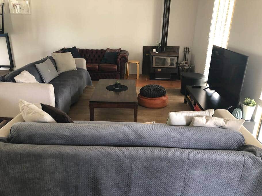 Living room with tile fire &amp; tv