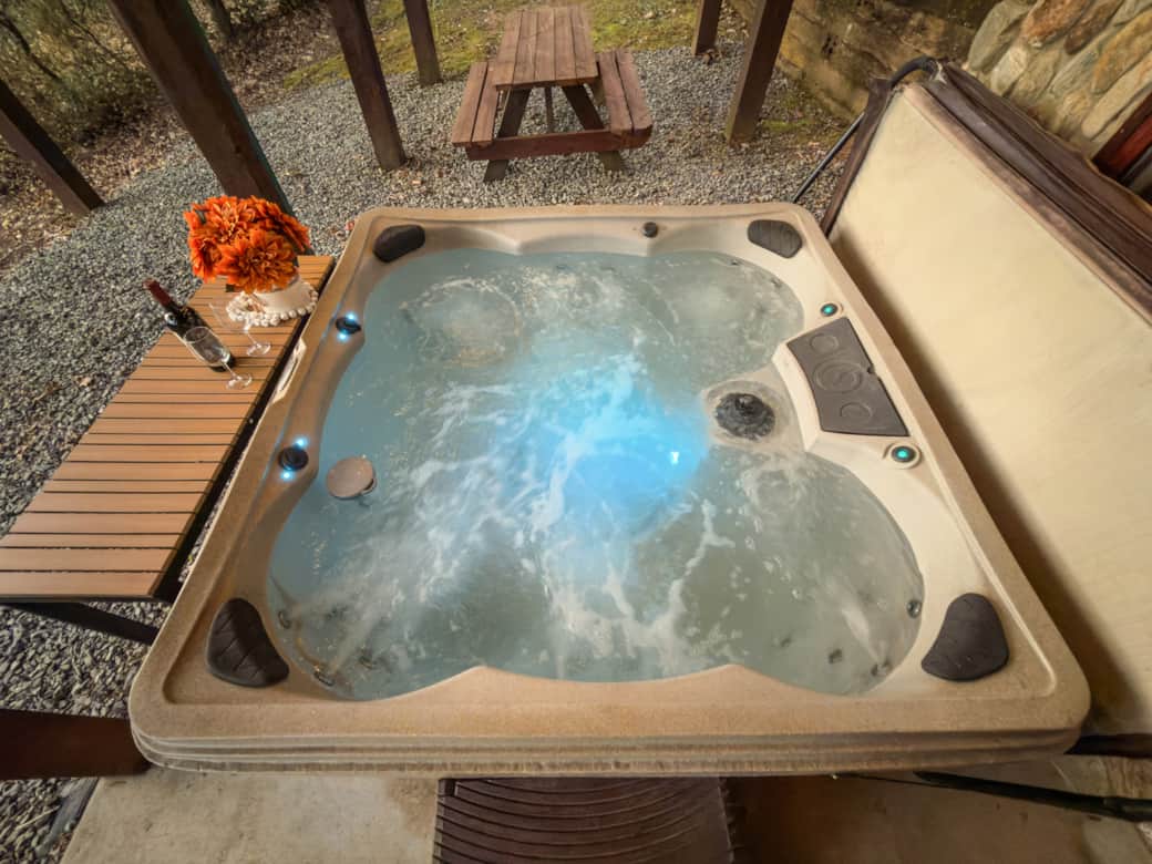 Lovely warm covered hot tub with table for convenience Lovely warm covered hot tub with table for convenience