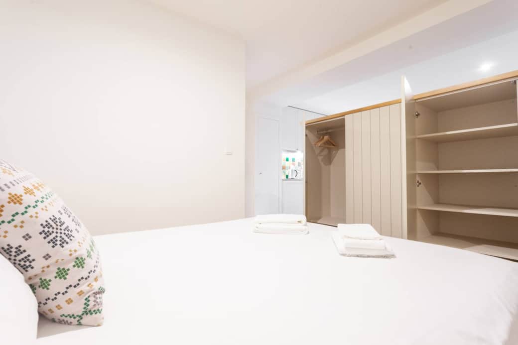 Lots of storage !

The apartment is a studio but there is a wardrobe which divides the space and provides privacy between "bed space" and the "living space"