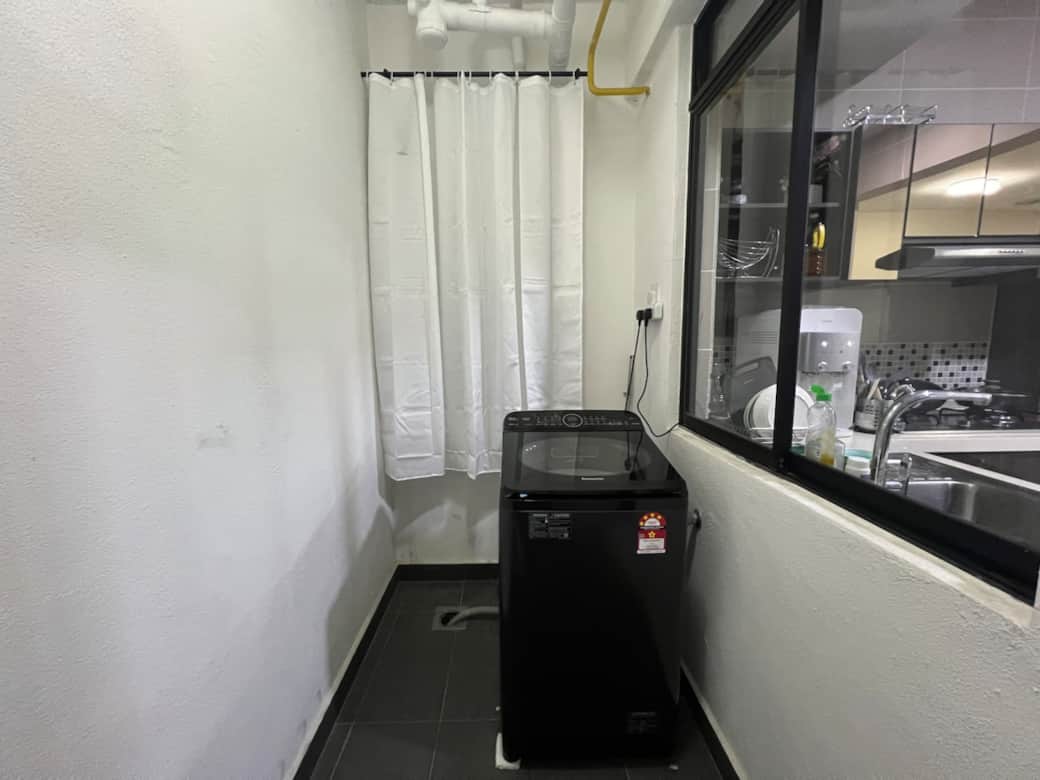 Modern kitchen with laundry and storage facilities. Modern kitchen with laundry and storage facilities.