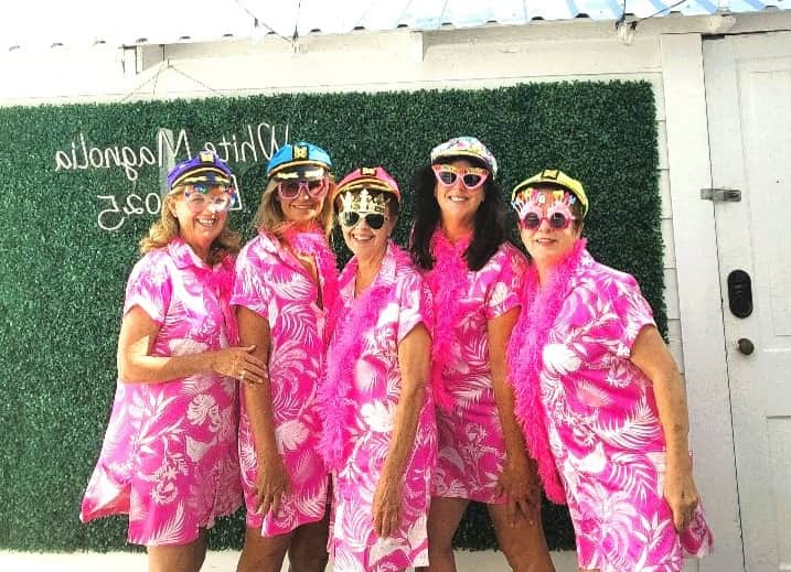 Friends celebrating together at White Magnolia Galveston during a birthday weekend