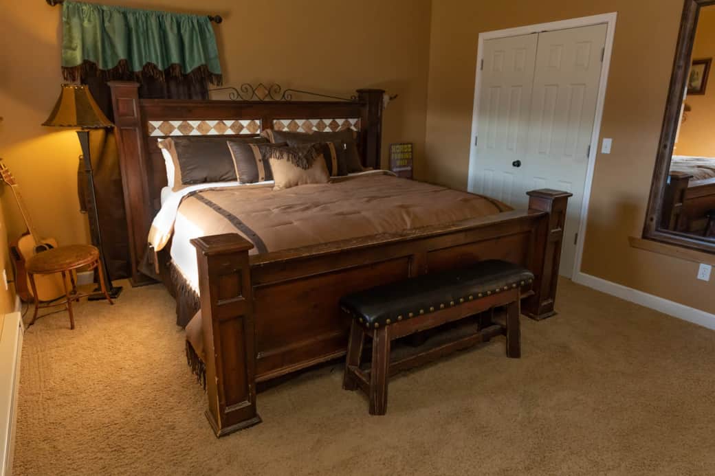 Bedroom 1 has a king sized bed, Roku equipped TV, and patio.