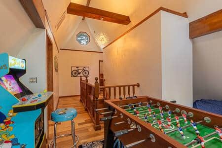Arcade games, foosball and more are at the top of the stairs Arcade games, foosball and more are at the top of the stairs