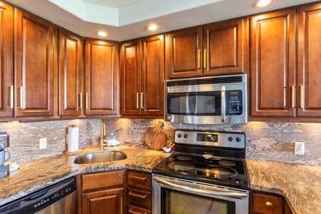 Frigidaire appliances. Full size stove, microwave and fridge with ice maker.