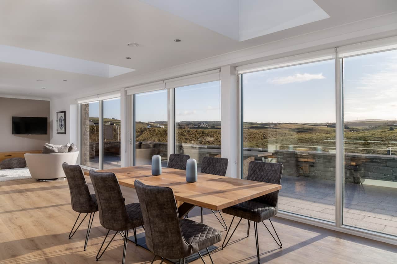 Dining area with floor to ceiling windows 