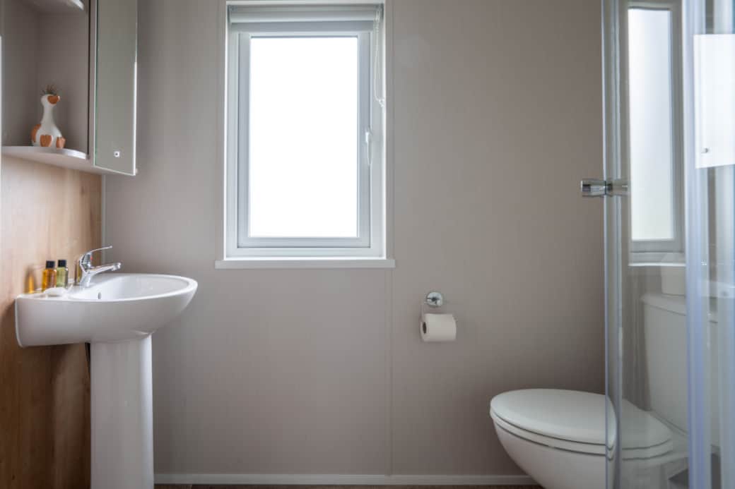 The master bedroom includes its own private en suite shower room