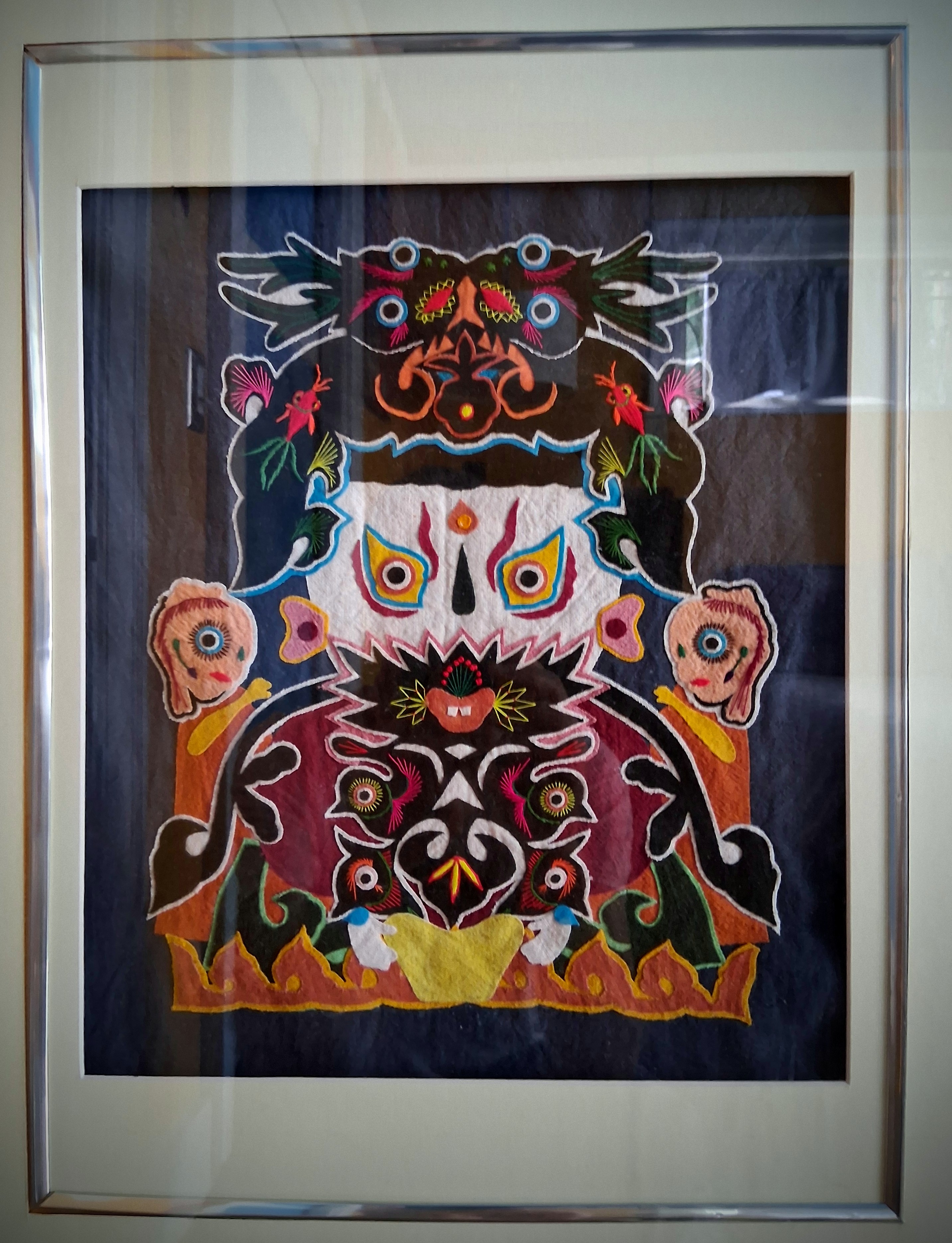 This heirloom tapestry on the bedroom door served as the color palette for the home.