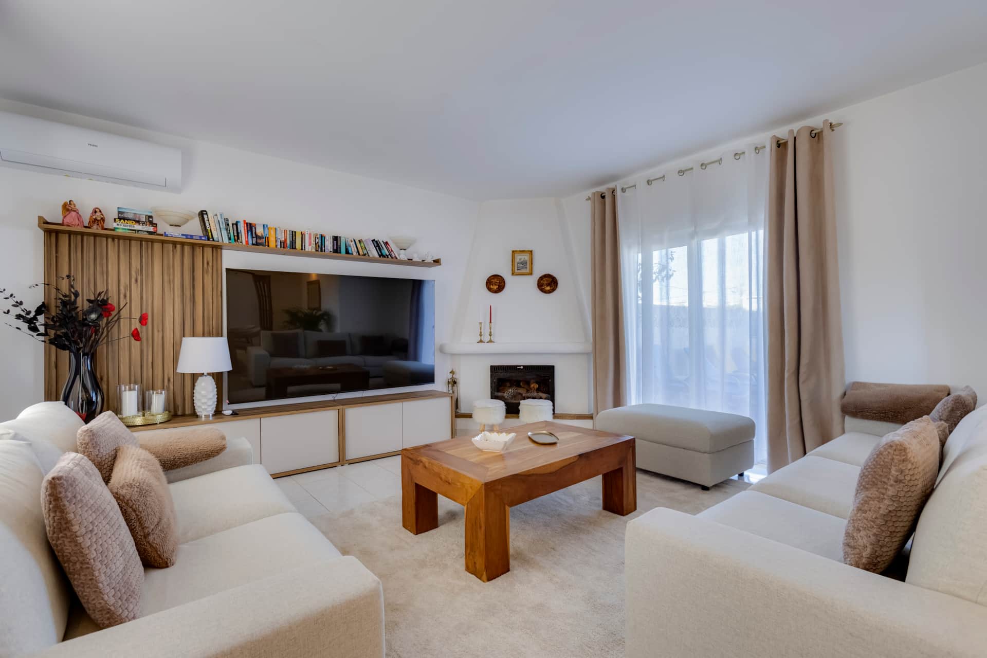 Cozy living room with fireplace and Smart TV in Algarve villa
