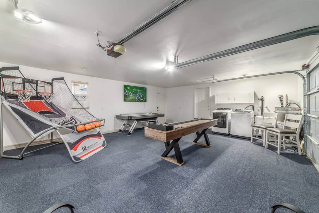 Game room with arcade basketball game, shuffleboard table and air hockey table. Samsung Washer and Dryer. Game room with arcade basketball game, shuffleboard table and air hockey table. Samsung Washer and Dryer.