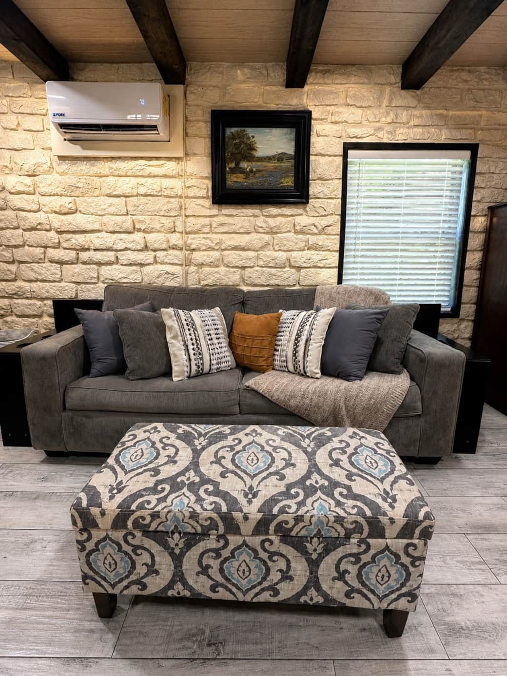 Comfortable lounge space with plush seating and soft textures.