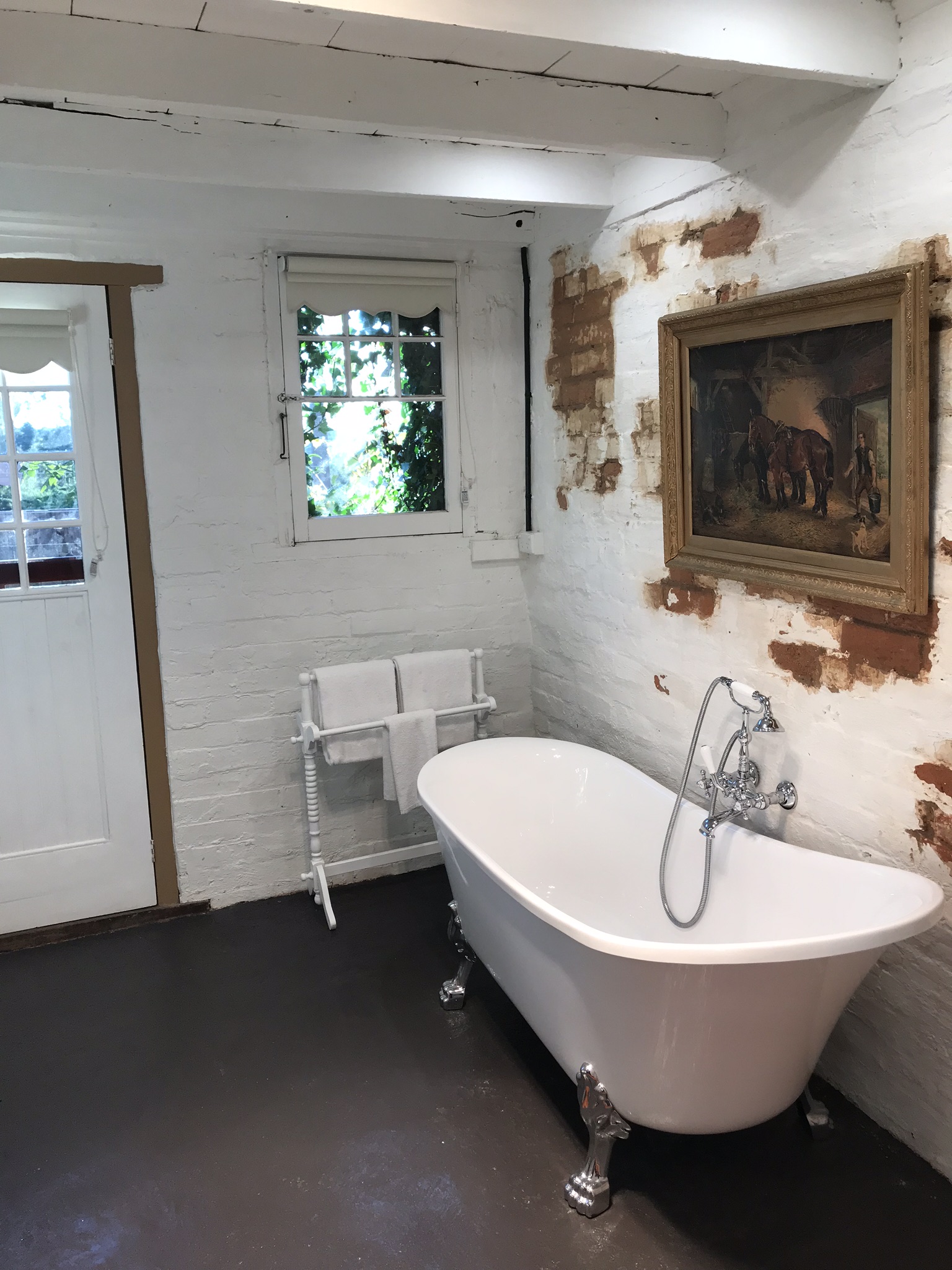 Bathroom with clawfoot bathtub and shower