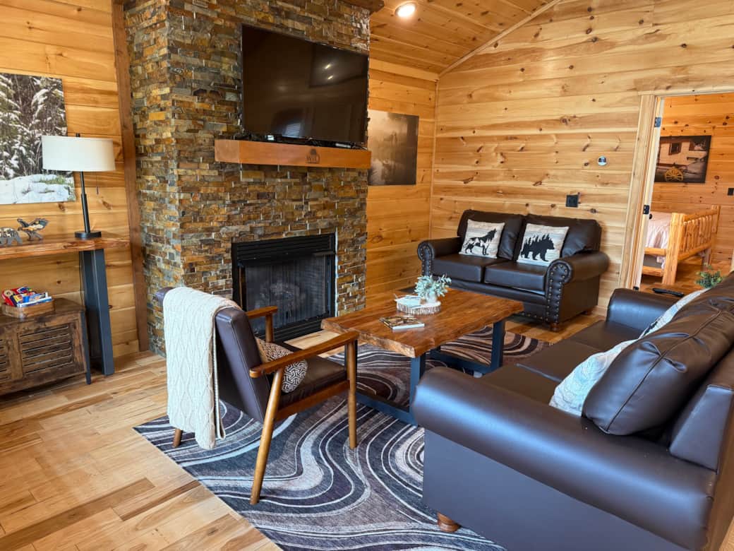 Living Room with Smart TV, Game Chest, and Gas Fireplace