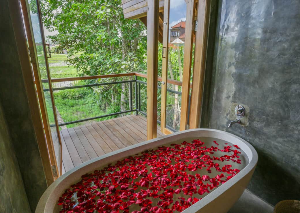 Freestanding bathtub with tranquil rice-field view