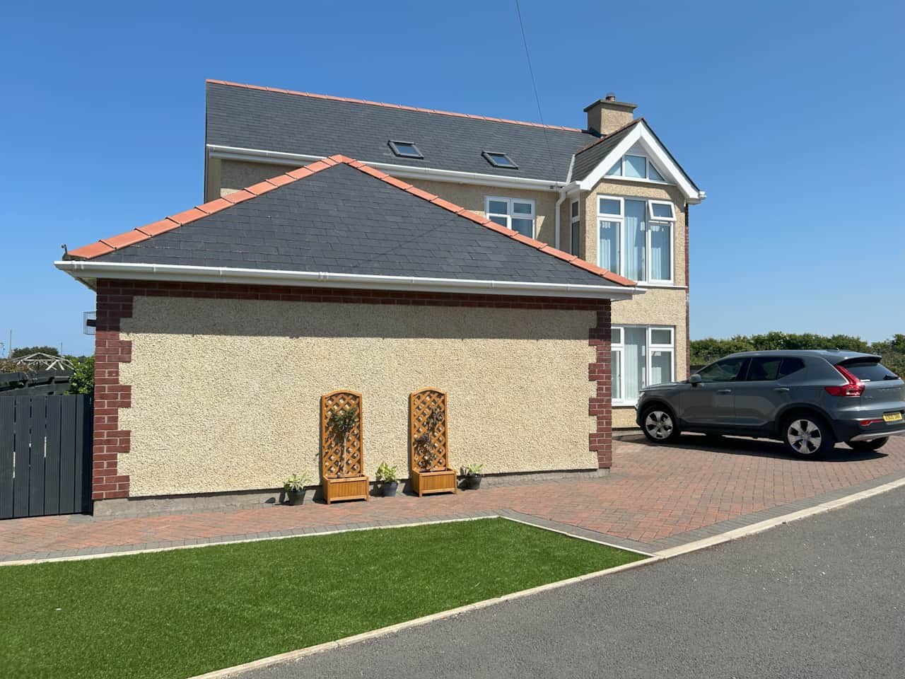 Front of house with parking area at Awel y Môr