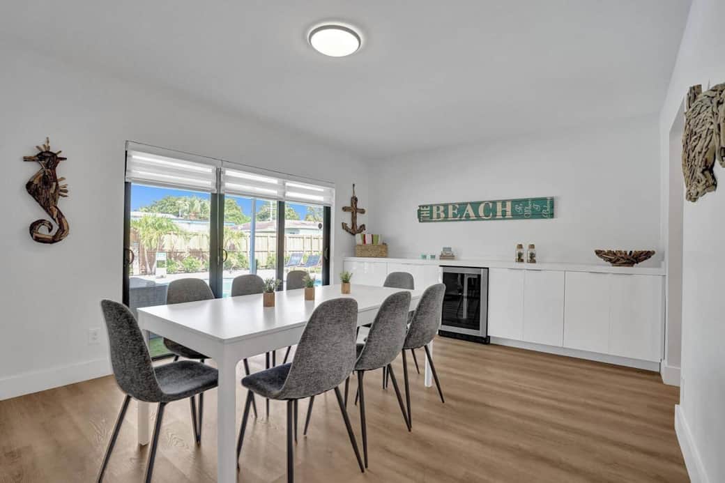 Dining room 1 with beverage cooler and bar. 
