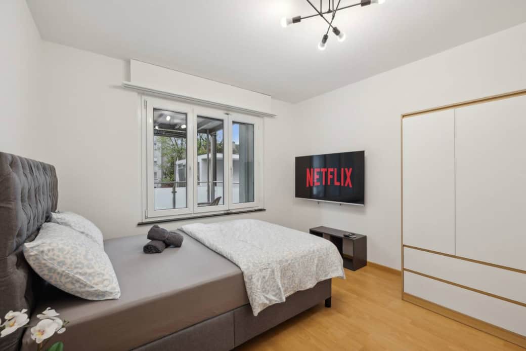 Your private room with comfy double bed, big window and 55'' Smart TV with Netflix.