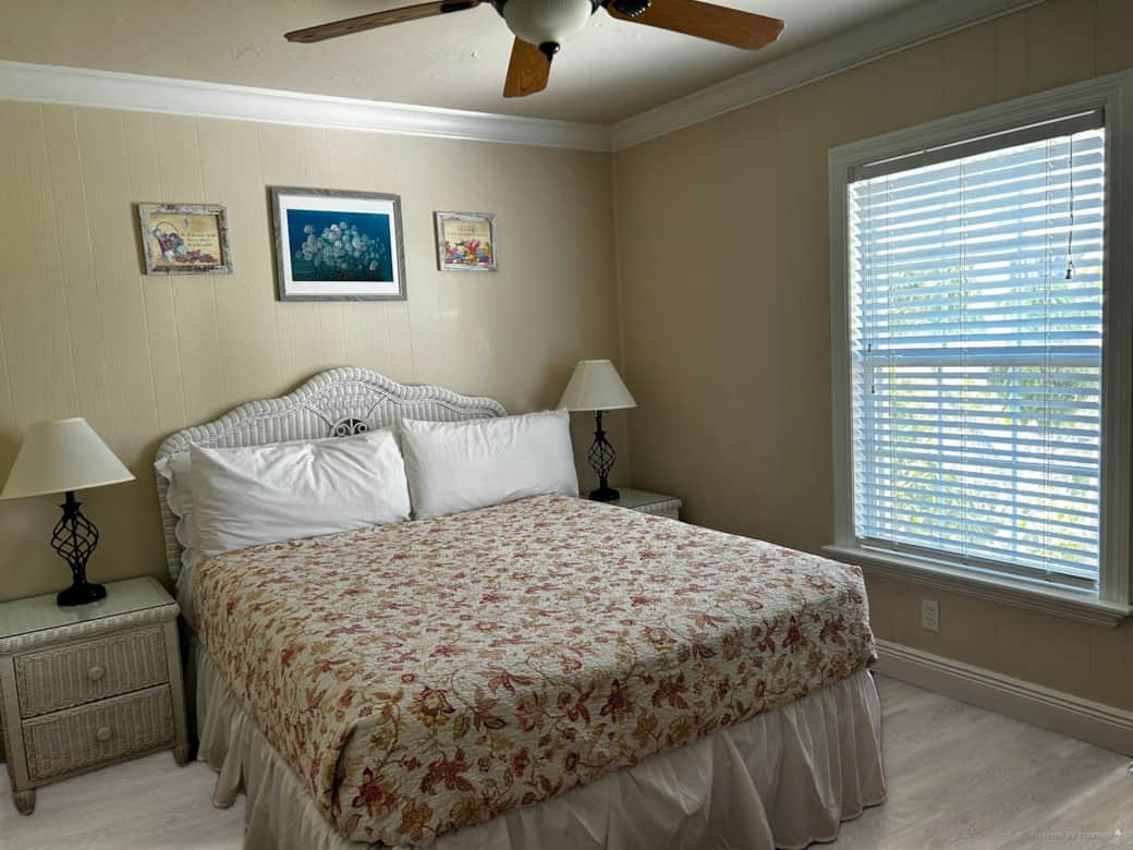 Master bedroom with queen size bed & ceiling fan