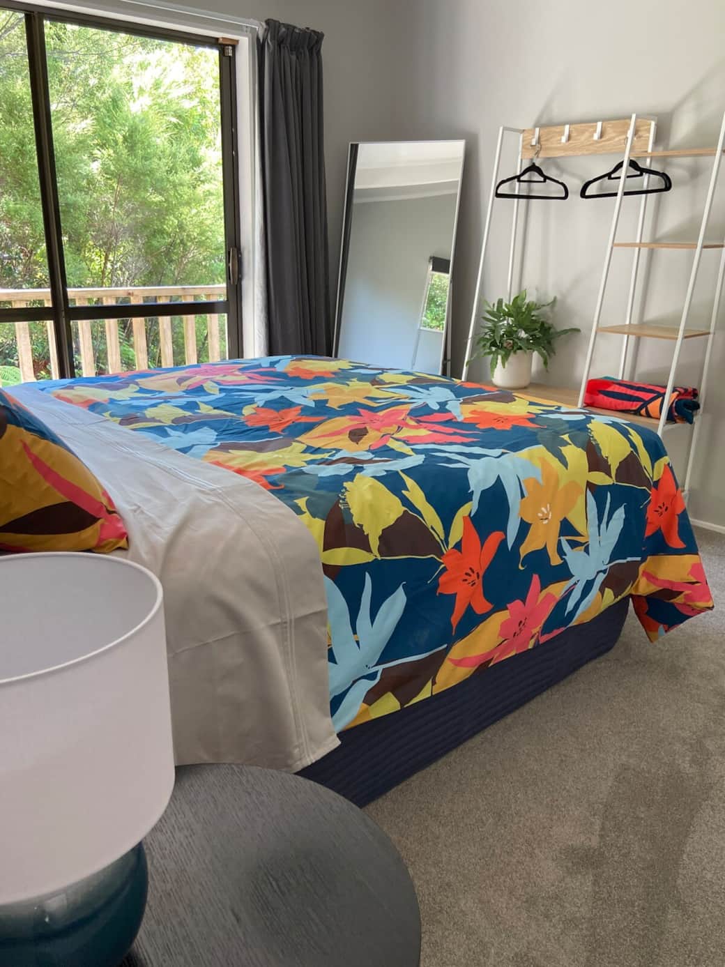 Master bedroom with tropical linen and native bush outlook