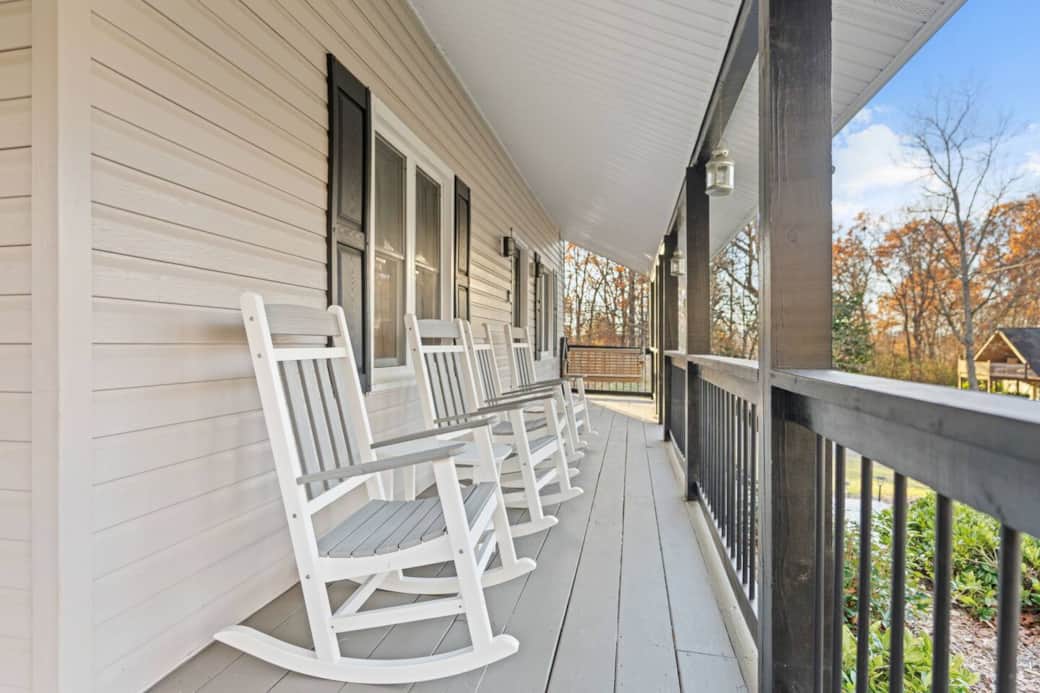 Wrap around porch with rocking chairs for four
