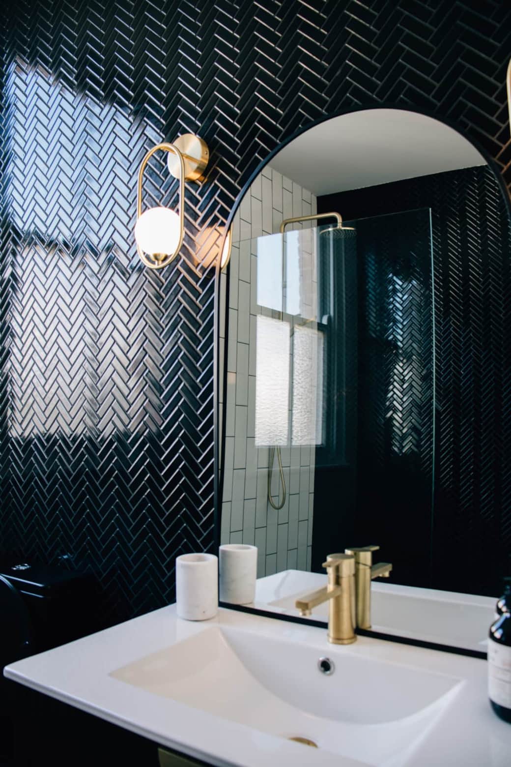 Beautiful black and white modern deco bathroom with brass fittings Beautiful black and white modern deco bathroom with brass fittings