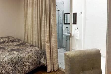 Room 2, Bathroom: Private ensuite bathroom with modern fixtures and essential toiletries.