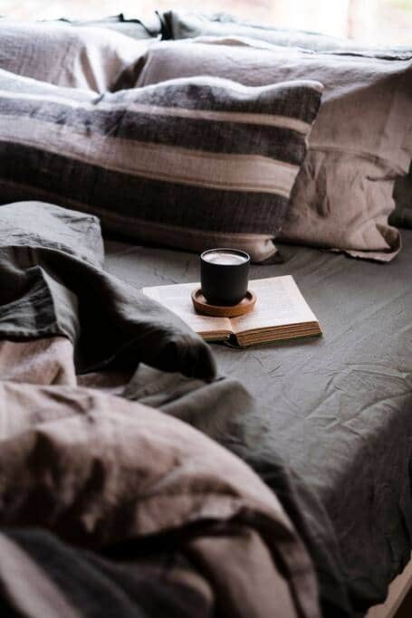 Luxurious European linen drapes the generous king size bed