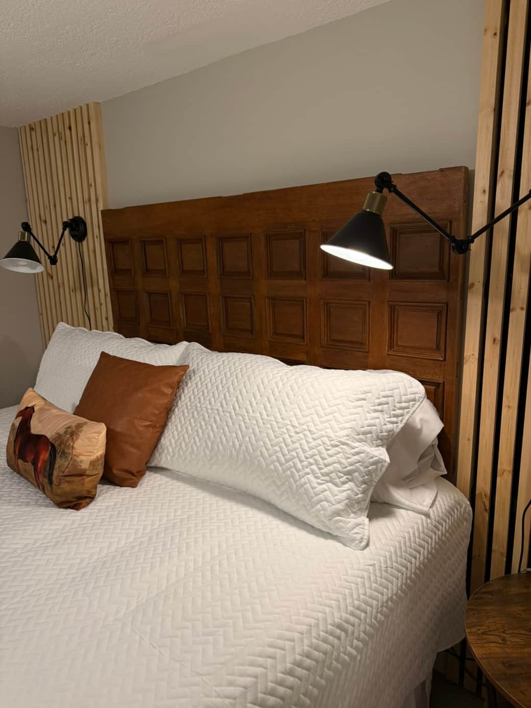 the repurposed door for this custom headboard came from the first church in the Village