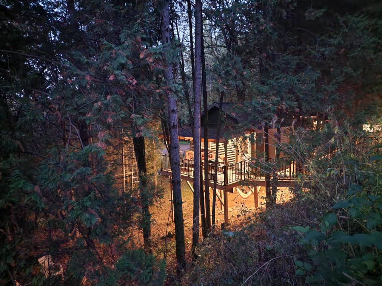 Cabin #1 exterior from driveway night cafe lights on
