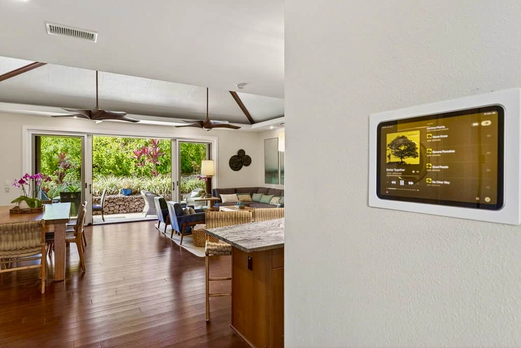 Smart home with iPad command center for music in every room, AC, lighting, and Roborock vacuum/mop.