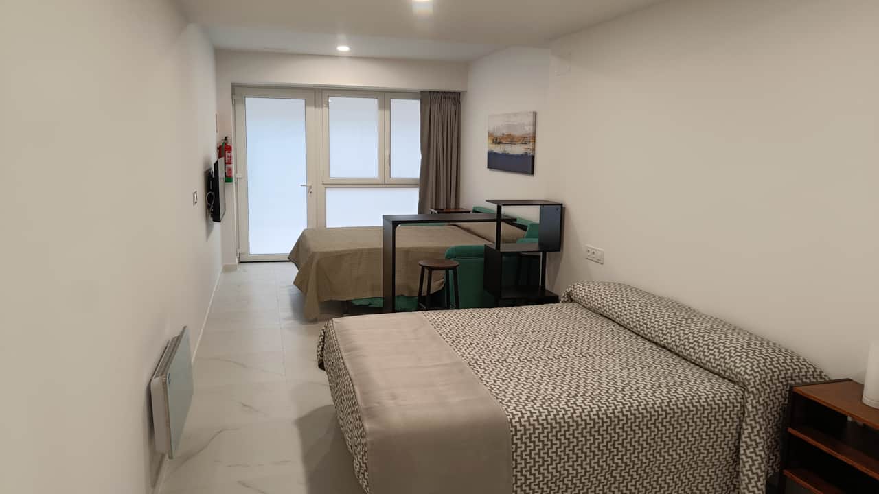 Dormitorio doble con zona de descanso