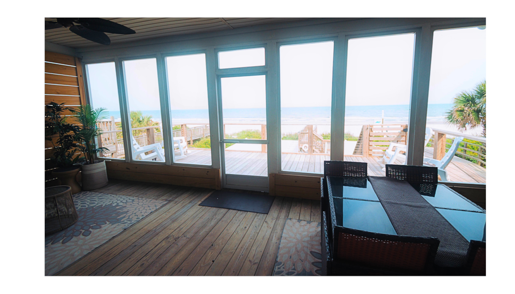 screened in porch with deck overlooking the beautiful ocean