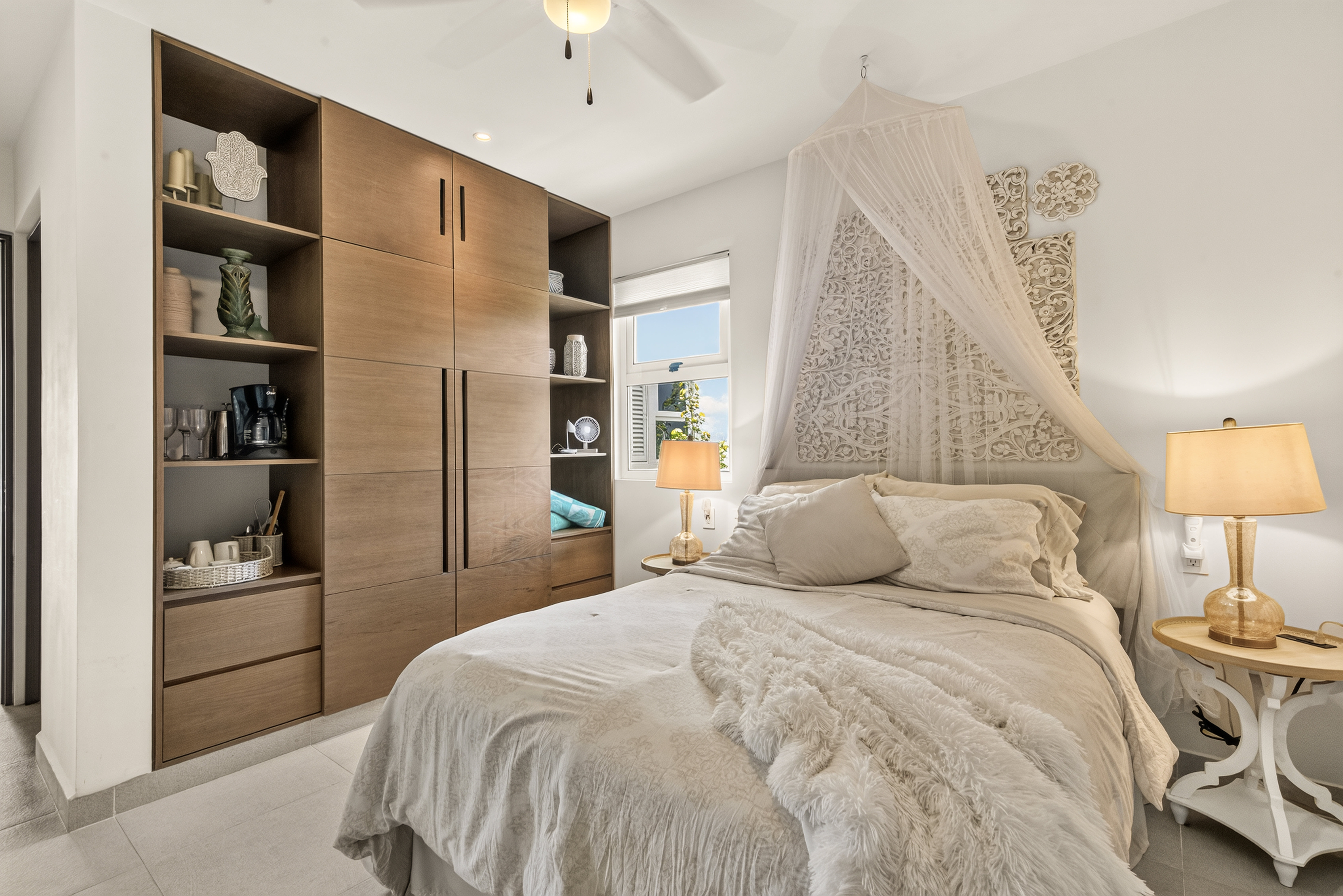 Private bedroom with ensuite bath, AC, mosquito net, wardrobe, beach towels, and easy charging.