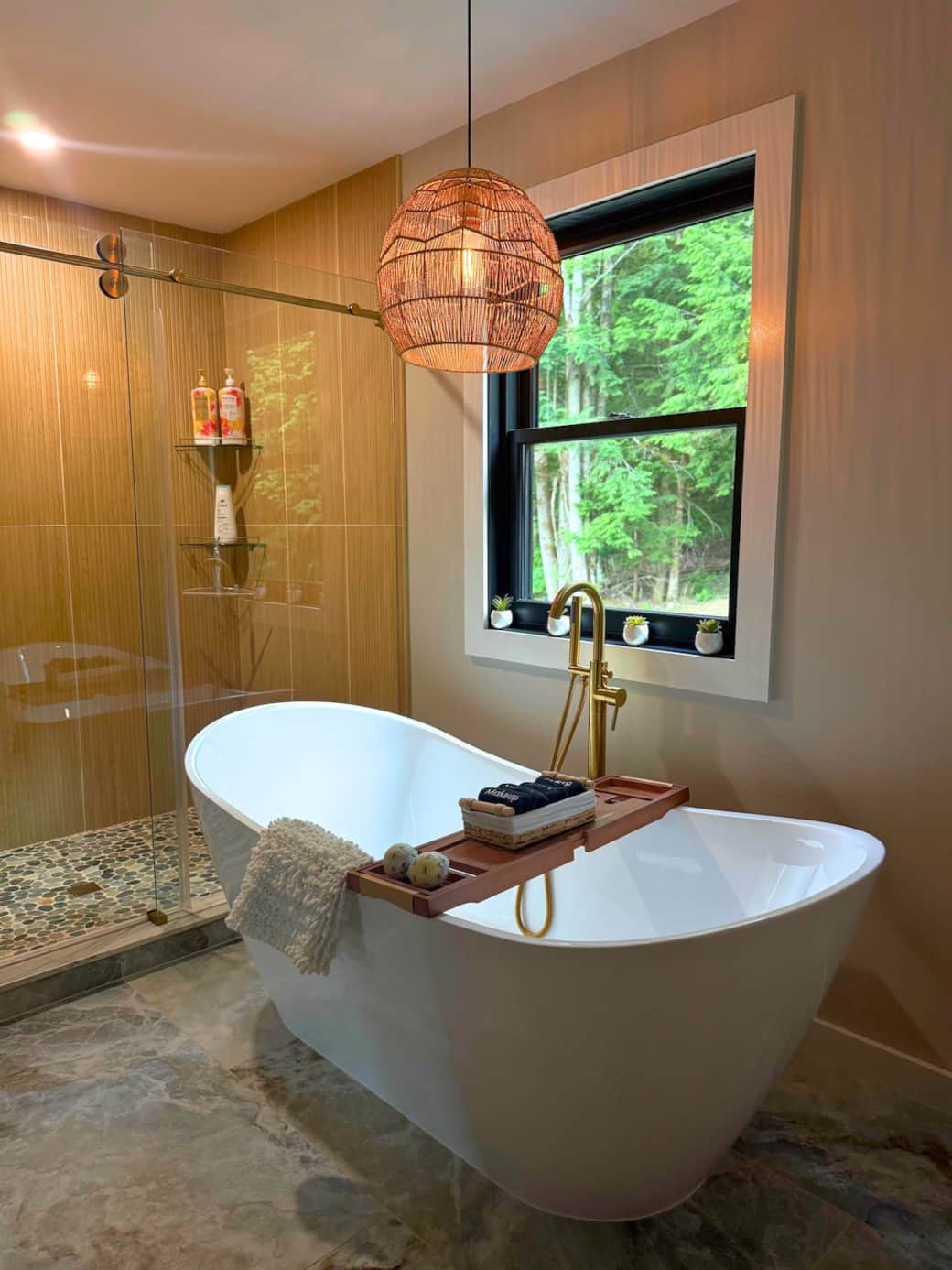 Relax in the soaking tub with a bath bomb and enjoy the view of the forest in full bloom during the summer! 