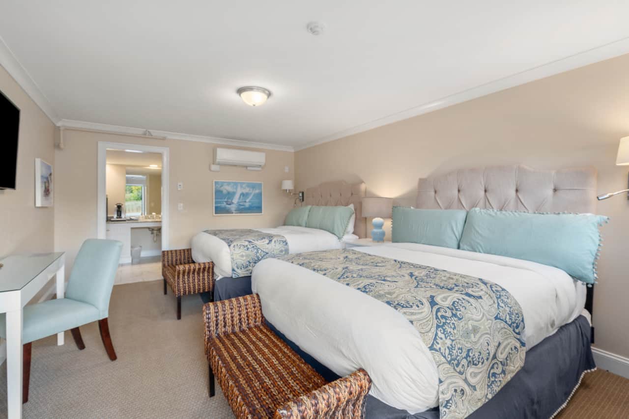 Two Queen Beds, workspace area, and cable tv!
