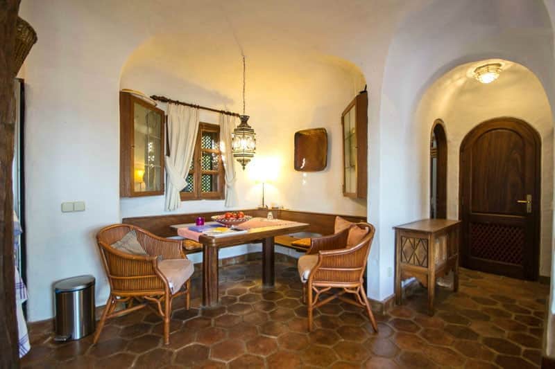 Rocadelmar1 indoor dining area rounded hallway with second bathroom and cupboard doors