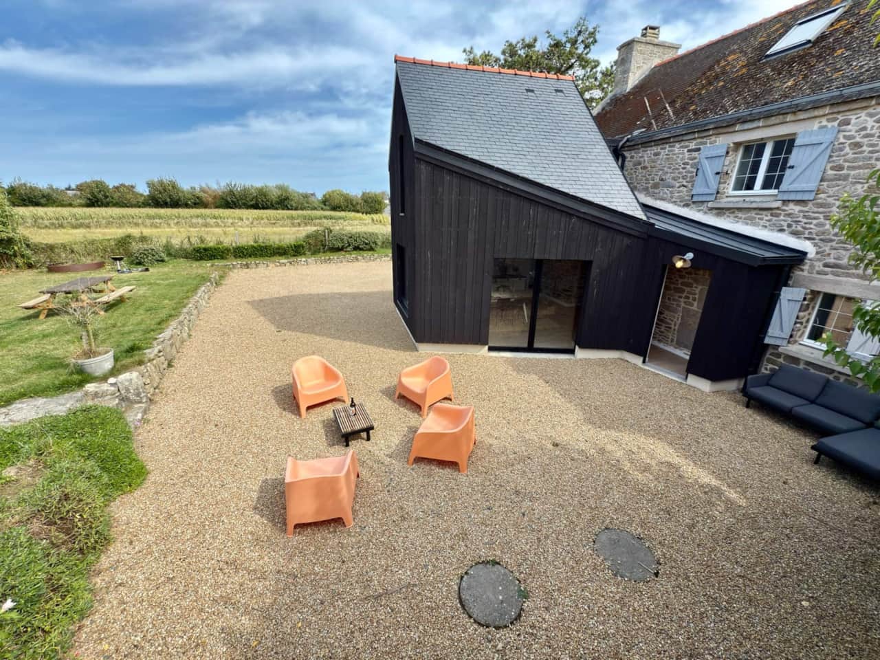 Architect-designed extension with sliding glass doors onto the terrace