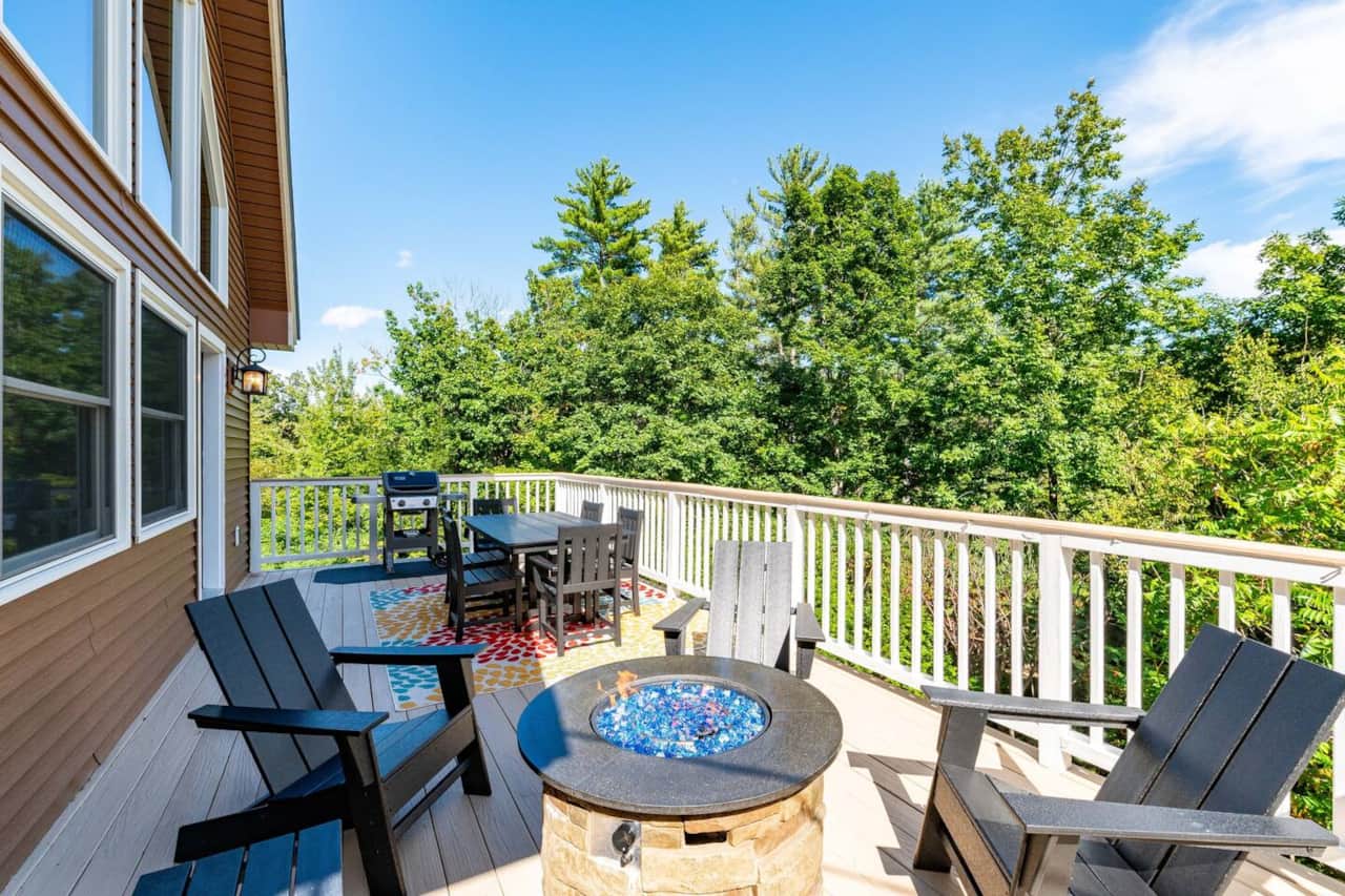 Full length deck with Polywood furniture and propane fire pit