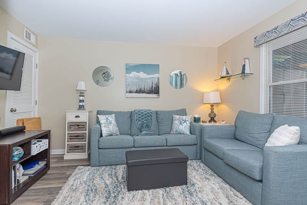 Sleeper sofa, extra pillows and  blanket in ottoman