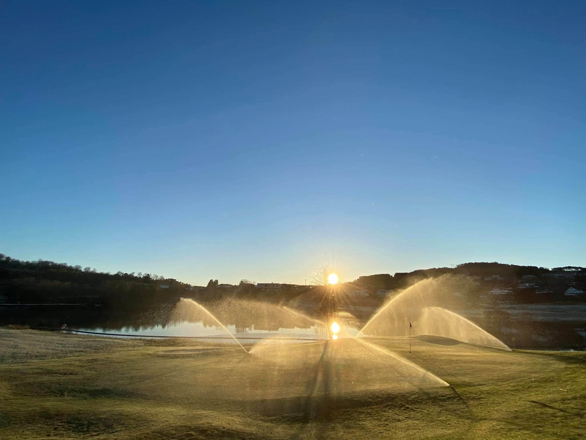 Hole 6 being watering in the morning sun Hole 6 being watering in the morning sun
