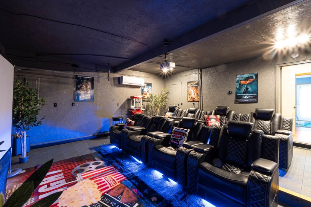 Theater room with projector, 120" screen, reclining seats and popcorn machine!